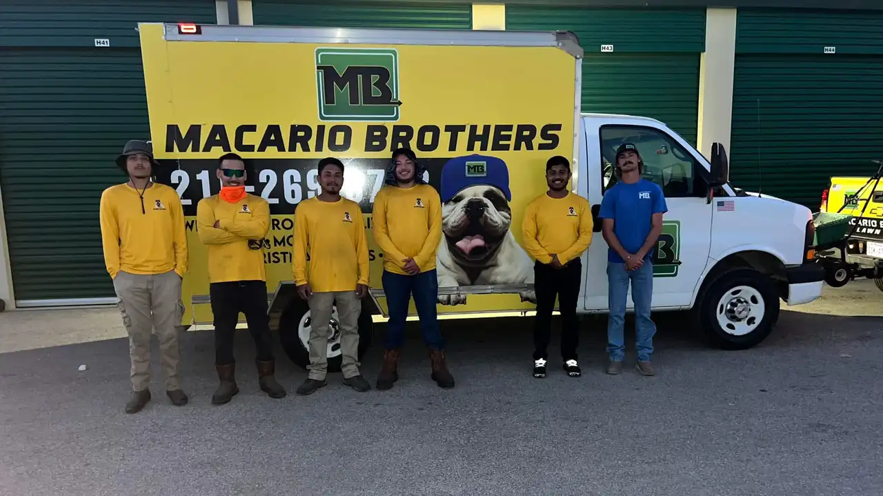 Macario Brothers crew standing in front of branded yellow box truck